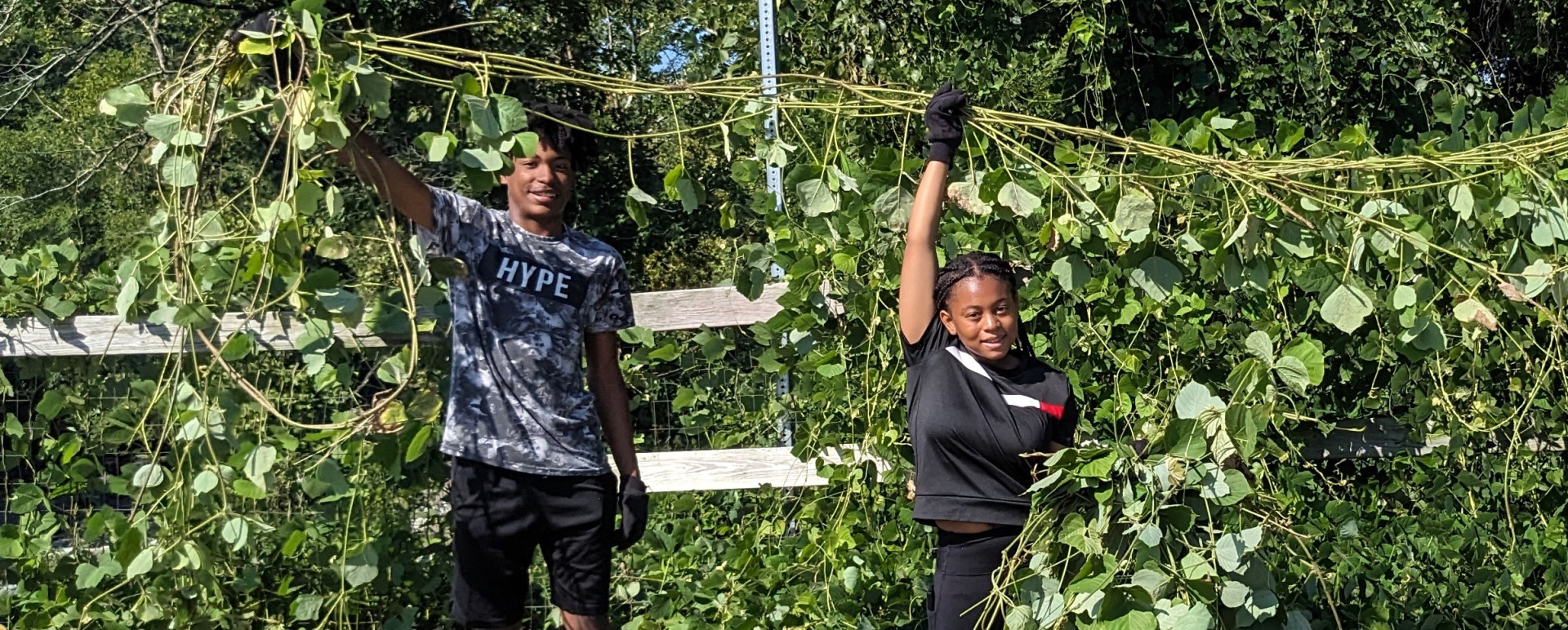 Kids holding up vine cropped