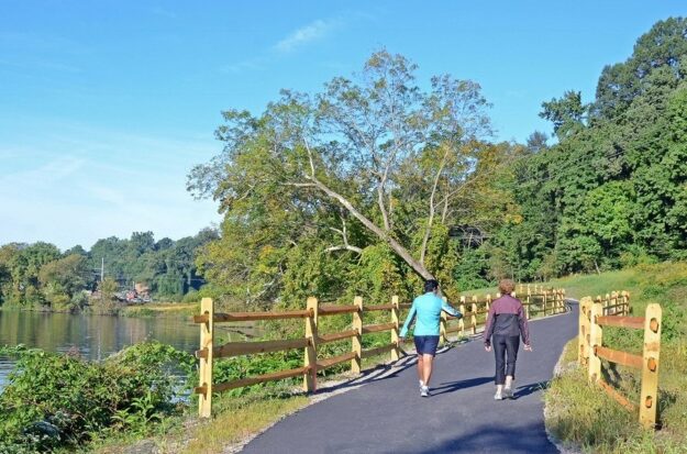 Two people walk down the Appomattox River trail in Colonial Heights